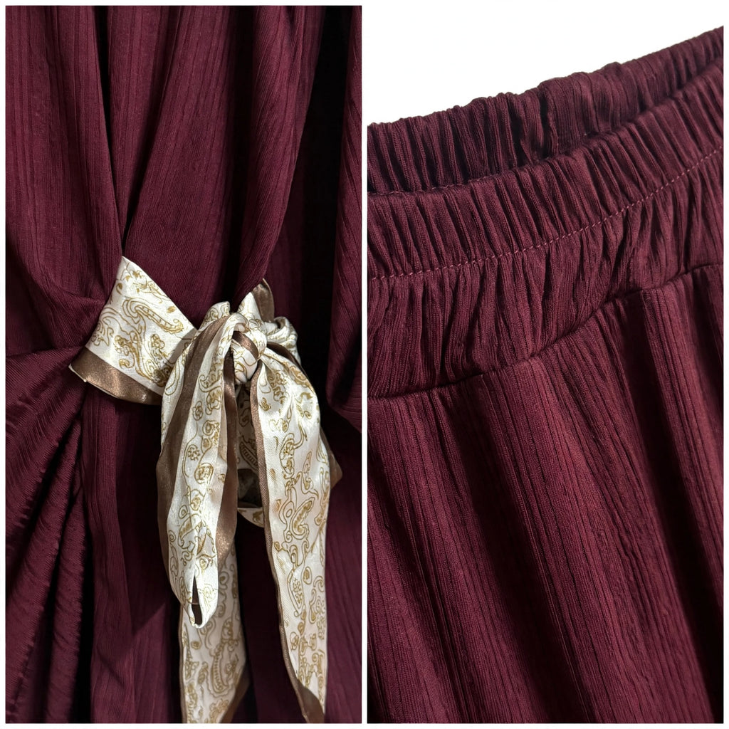 Detalle de conjunto las cucadas de erisa en color burdeos con textura acanalada, lazada lateral estampada y cintura elástica