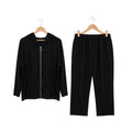 Conjunto deportivo negro las cucadas de erisa con sudadera de cremallera y pantalón de corte relajado