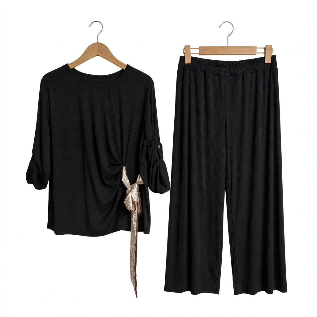 Conjunto de dos piezas las cucadas de erisa en negro con blusa de lazada lateral y pantalón de pernera ancha acanalado
