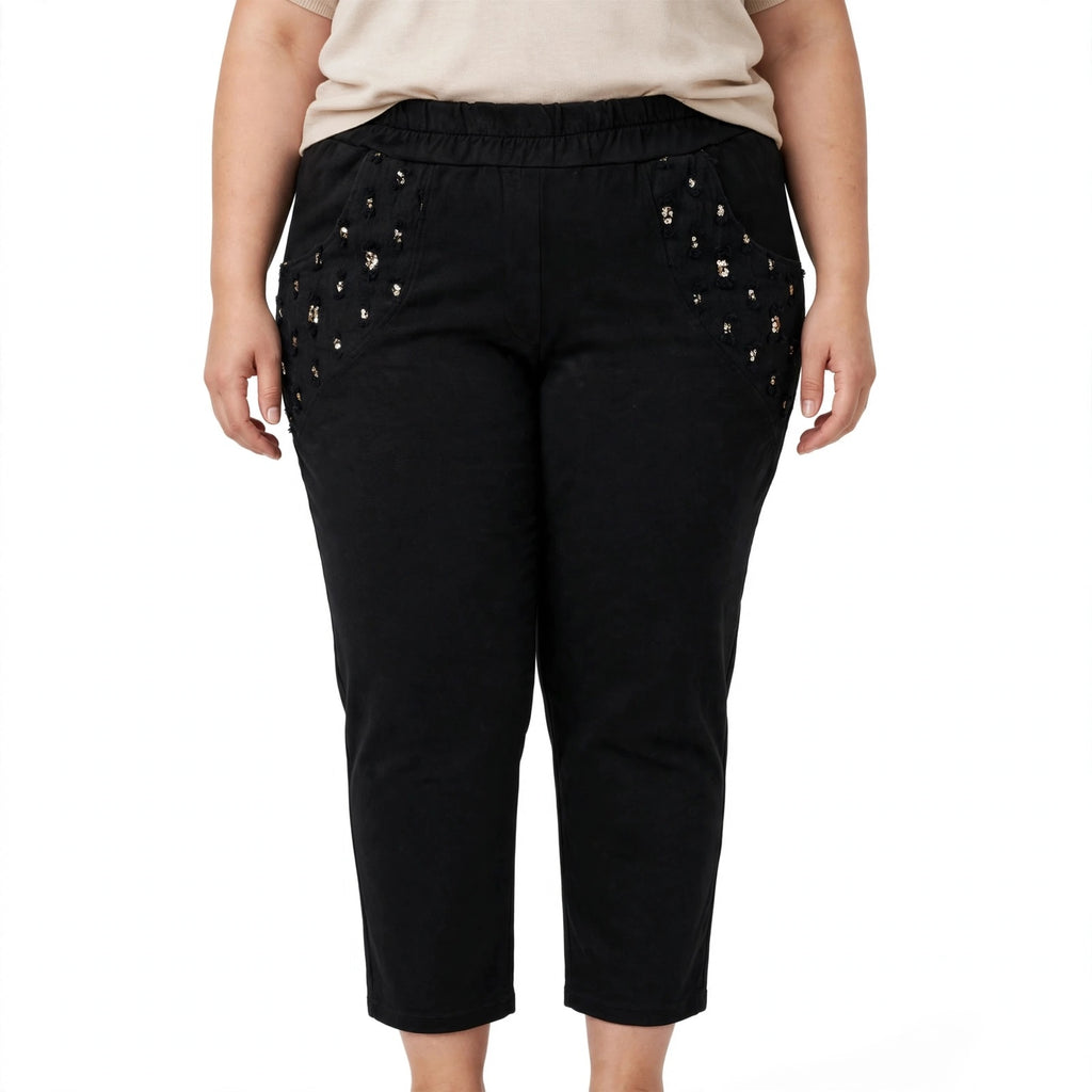 Pantalón negro casual de las cucadas de erisa con cintura elástica y bolsillos laterales decorados con lentejuelas.