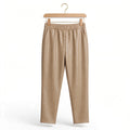 Pantalones las cucadas de erisa de efecto piel en color beige con cintura elástica y bolsillos laterales en percha
