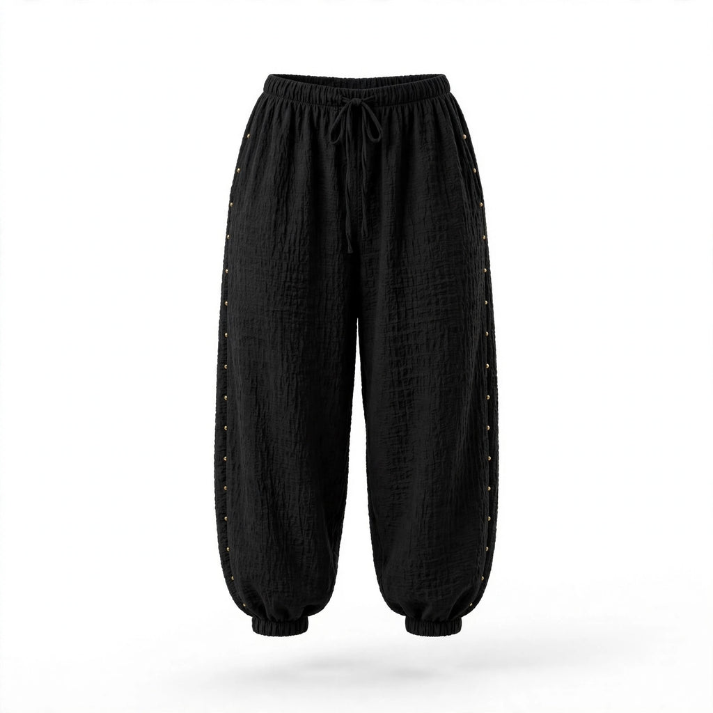 Pantalones jogger negros las cucadas de erisa de corte holgado con textura arrugada y detalles de tachuelas laterales