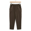 Pantalones casuales verde oliva de las cucadas de erisa con cintura elástica y bolsillos decorados con lentejuelas.
